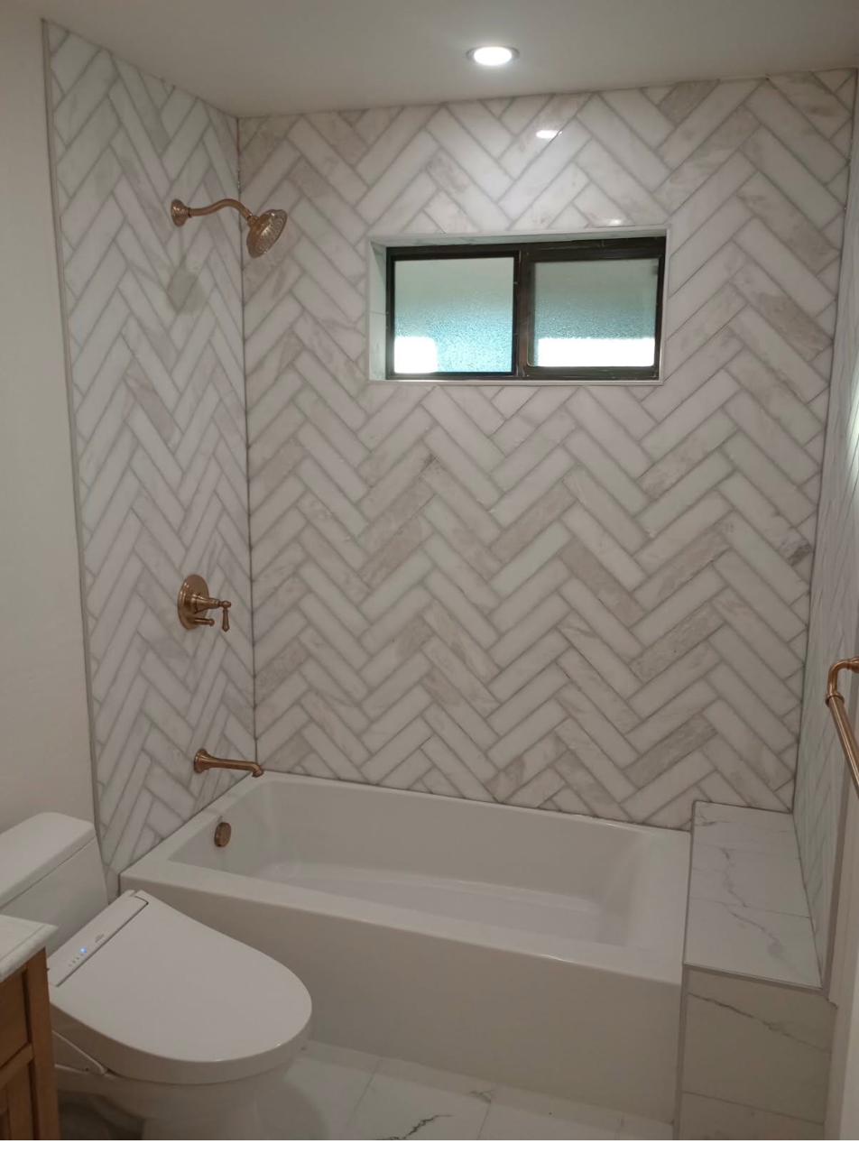 Herringbone marble tub and shower