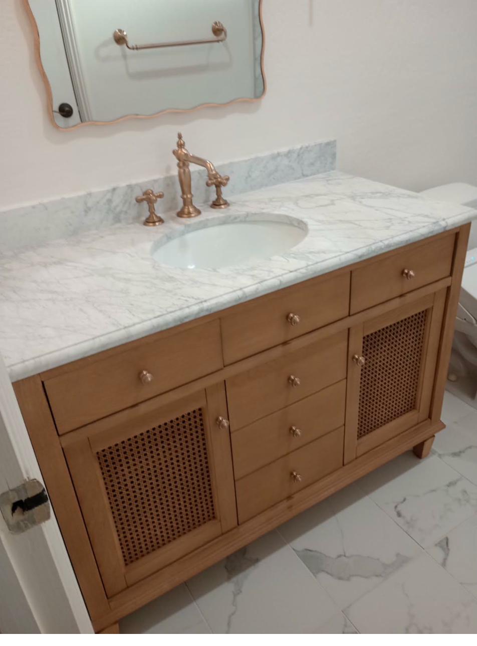 Custom vanity with cane cabinet doors